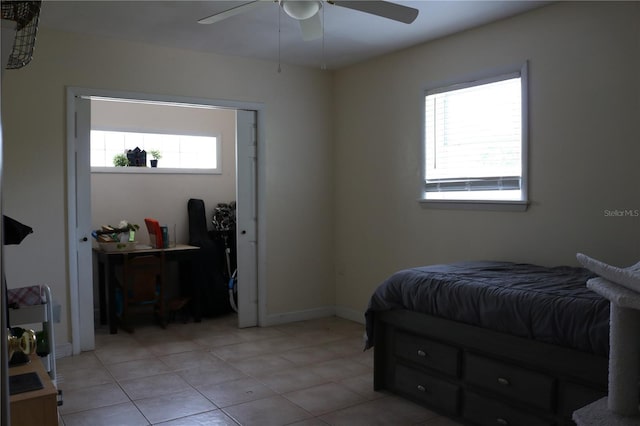24391 NW 172nd Ave, High Springs, FL 32643 - bedroom with light tile patterned floors, ceiling fan, and baseboards