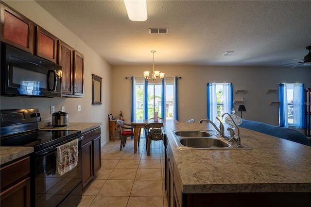 249 Haines Blvd, Winter Haven, FL 33881 - kitchen featuring plenty of natural light, visible vents, a sink, and black appliances