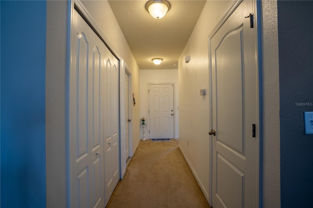 249 Haines Blvd, Winter Haven, FL 33881 - corridor with baseboards and light colored carpet