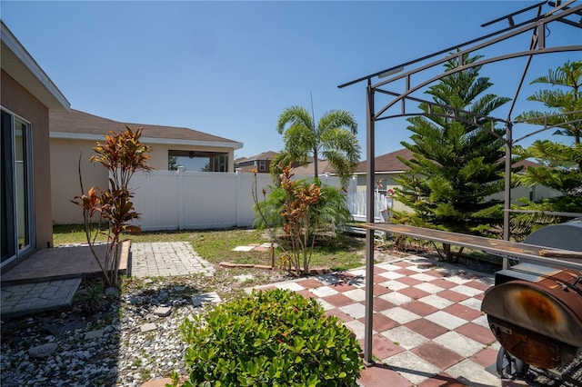 249 Haines Blvd, Winter Haven, FL 33881 - view of yard featuring a patio area, glass enclosure, and fence