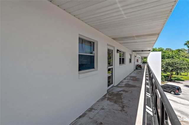 exterior space featuring a balcony and stucco siding