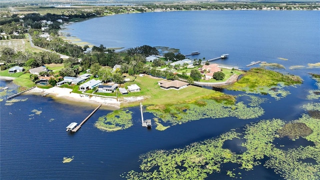 drone / aerial view with a residential view and a water view