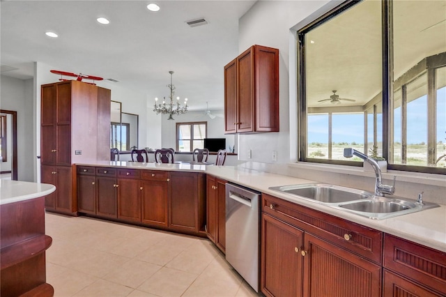kitchen featuring light countertops, a healthy amount of sunlight, dishwasher, and a sink