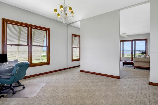 office area featuring a notable chandelier, baseboards, and carpet floors