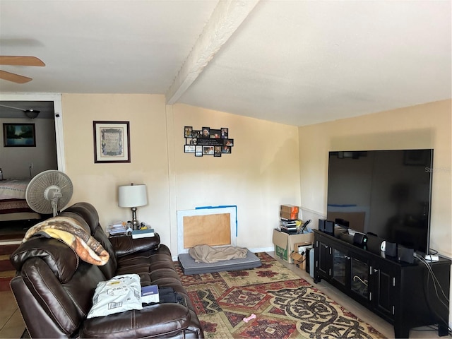living area with vaulted ceiling with beams and ceiling fan