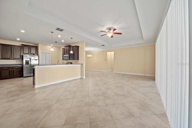 kitchen featuring a ceiling fan, open floor plan, dark brown cabinetry, stainless steel appliances, and visible vents