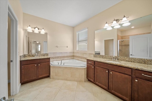 full bath with tile patterned floors, a sink, a bath, two vanities, and a stall shower