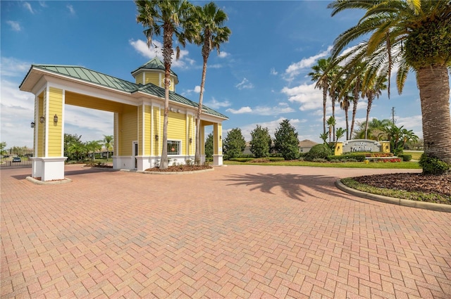 view of community with curved driveway
