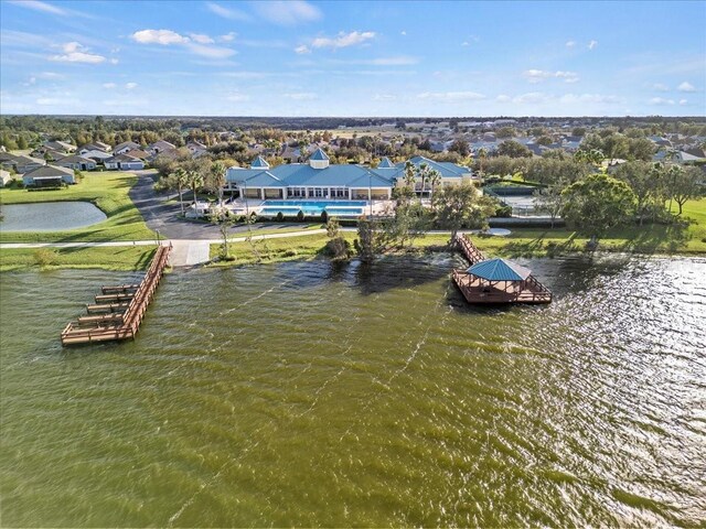 bird's eye view featuring a water view and a residential view