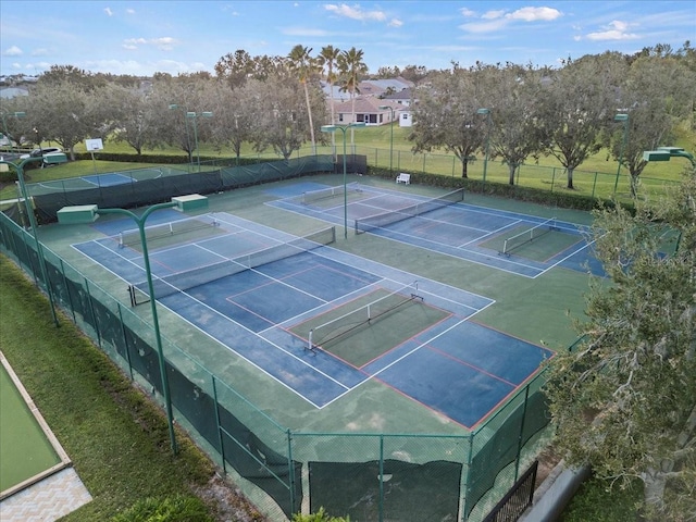 view of tennis court with fence