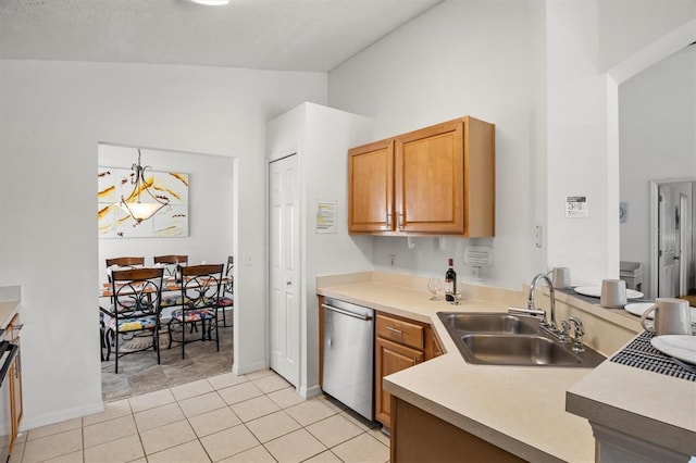 kitchen with high vaulted ceiling, stainless steel dishwasher, light tile patterned floors, light countertops, and a sink