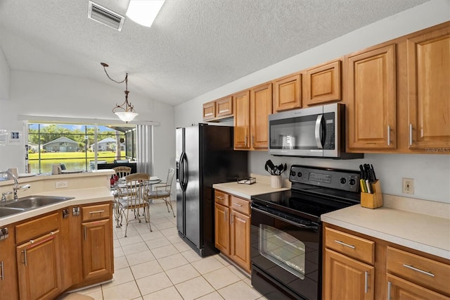 kitchen with vaulted ceiling, light tile patterned flooring, black appliances, visible vents, and a sink