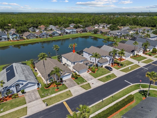 bird's eye view featuring a water view and a residential view