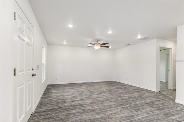 empty room featuring baseboards, a ceiling fan, dark wood-style floors, and recessed lighting