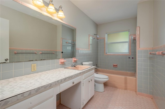 703 Osceola Ave, Lake Wales, FL 33853 - full bathroom with vanity, tile walls, shower / tub combination, toilet, and tile patterned flooring