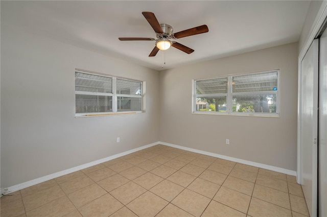 703 Osceola Ave, Lake Wales, FL 33853 - empty room with baseboards, a ceiling fan, and light tile patterned flooring
