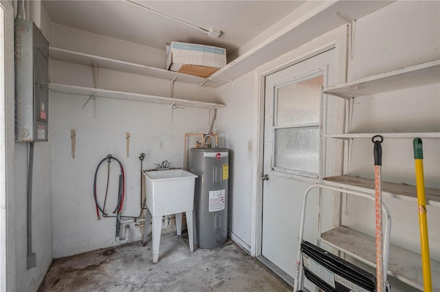 703 Osceola Ave, Lake Wales, FL 33853 - utility room with water heater, a sink, and electric panel