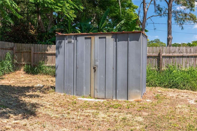 703 Osceola Ave, Lake Wales, FL 33853 - view of shed with a fenced backyard