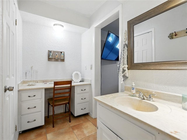 bathroom with tile patterned floors and vanity