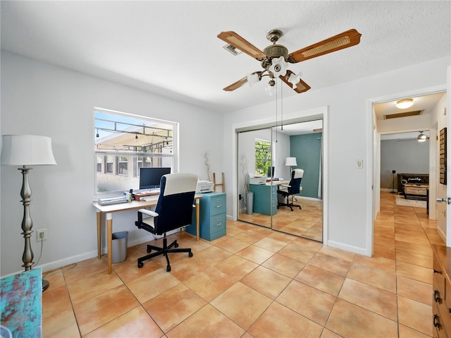 office area with a ceiling fan, visible vents, and light tile patterned flooring