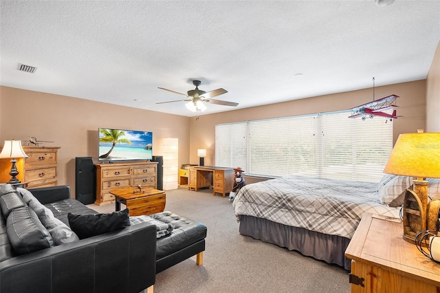 177 Costa Loop, Auburndale, FL 33823 - bedroom featuring light colored carpet, a textured ceiling, and ceiling fan