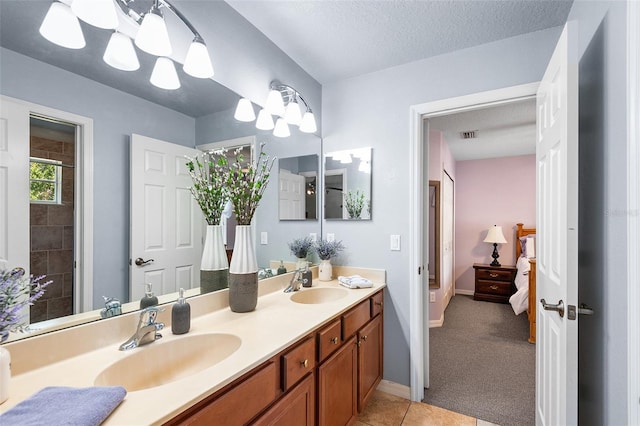 177 Costa Loop, Auburndale, FL 33823 - bathroom with double vanity, tile patterned floors, and baseboards