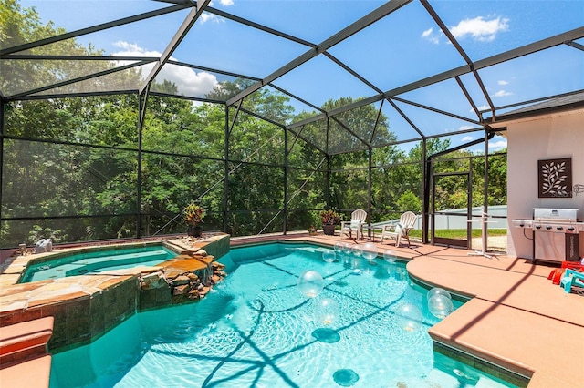 177 Costa Loop, Auburndale, FL 33823 - view of swimming pool with a pool with connected hot tub, grilling area, a patio, and glass enclosure