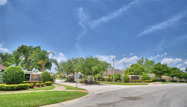 186 Viola Dr, Auburndale, FL 33823 - view of asphalt road with sidewalks, street lights, curbs, and traffic signs