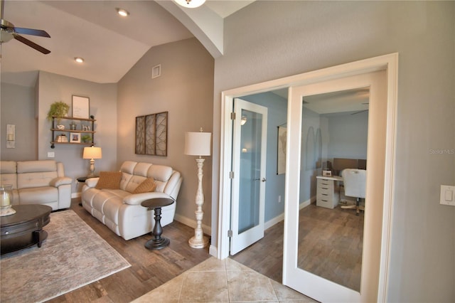 186 Viola Dr, Auburndale, FL 33823 - living room featuring a ceiling fan, lofted ceiling, a desk, wood finished floors, and arched walkways
