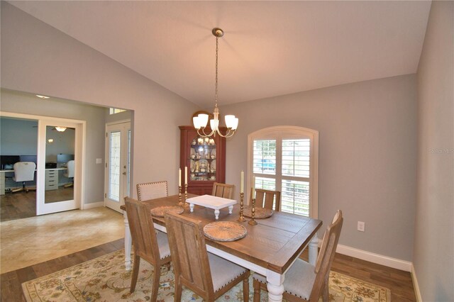 186 Viola Dr, Auburndale, FL 33823 - dining room with lofted ceiling, wood finished floors, baseboards, a chandelier, and an office area