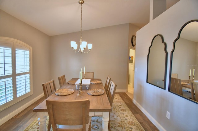 186 Viola Dr, Auburndale, FL 33823 - dining room with wood finished floors, baseboards, and a chandelier