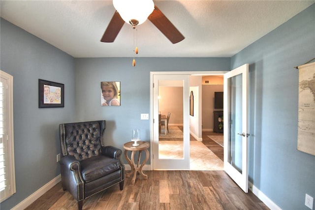 186 Viola Dr, Auburndale, FL 33823 - living area featuring french doors, wood finished floors, ceiling fan, and baseboards