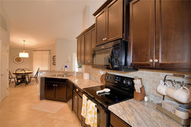 186 Viola Dr, Auburndale, FL 33823 - kitchen with black appliances, a sink, tasteful backsplash, light tile patterned floors, and a peninsula