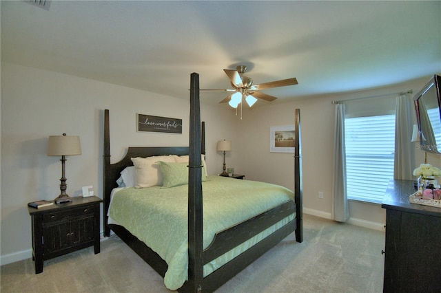 186 Viola Dr, Auburndale, FL 33823 - bedroom featuring light carpet, baseboards, and ceiling fan