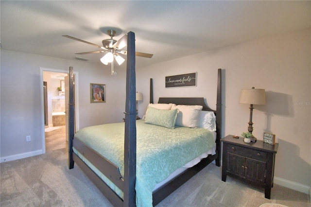 186 Viola Dr, Auburndale, FL 33823 - bedroom with carpet flooring, baseboards, a ceiling fan, and ensuite bathroom