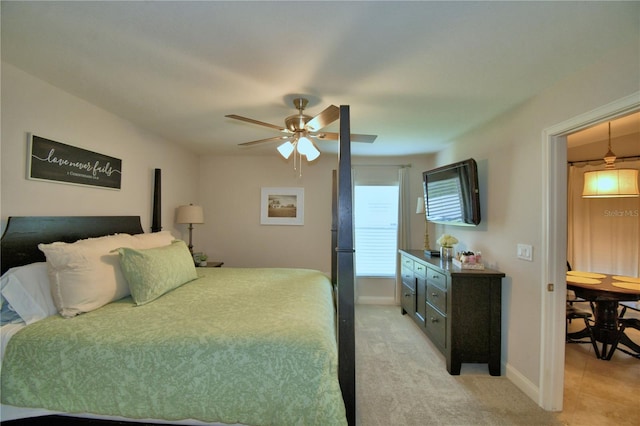 186 Viola Dr, Auburndale, FL 33823 - bedroom featuring baseboards, light colored carpet, and a ceiling fan