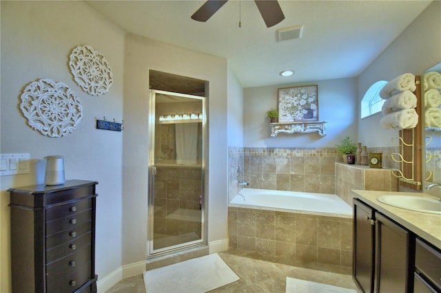 186 Viola Dr, Auburndale, FL 33823 - bathroom featuring a bath, a ceiling fan, a stall shower, and vanity