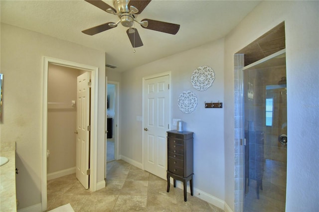 186 Viola Dr, Auburndale, FL 33823 - bathroom with a stall shower, a ceiling fan, vanity, and baseboards