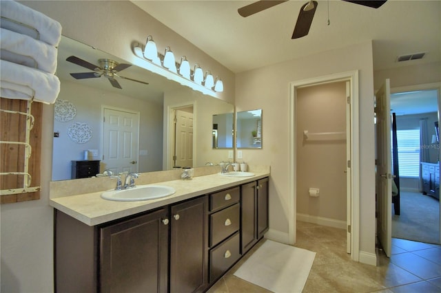 186 Viola Dr, Auburndale, FL 33823 - full bathroom featuring ceiling fan, tile patterned floors, double vanity, and baseboards
