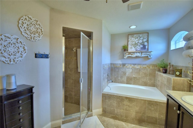 186 Viola Dr, Auburndale, FL 33823 - bathroom with a garden tub, a stall shower, vanity, and tile patterned floors