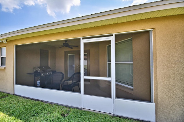 186 Viola Dr, Auburndale, FL 33823 - property entrance featuring stucco siding and a ceiling fan