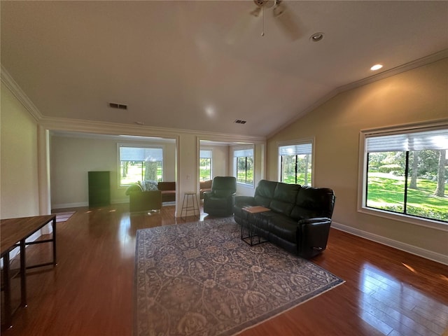 living area featuring wood finished floors and ornamental molding