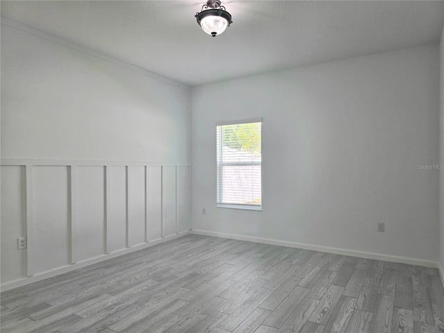 unfurnished room featuring wood finished floors