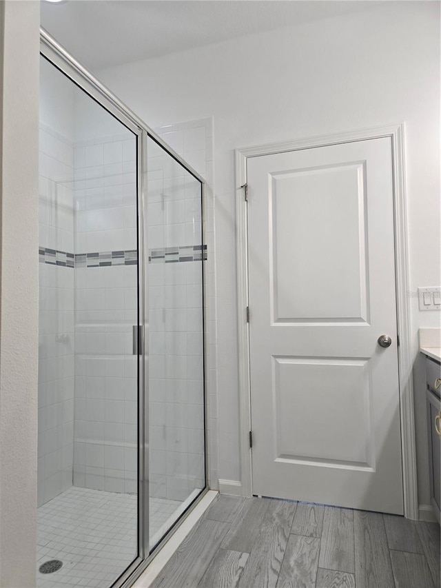 full bath featuring vanity and a stall shower