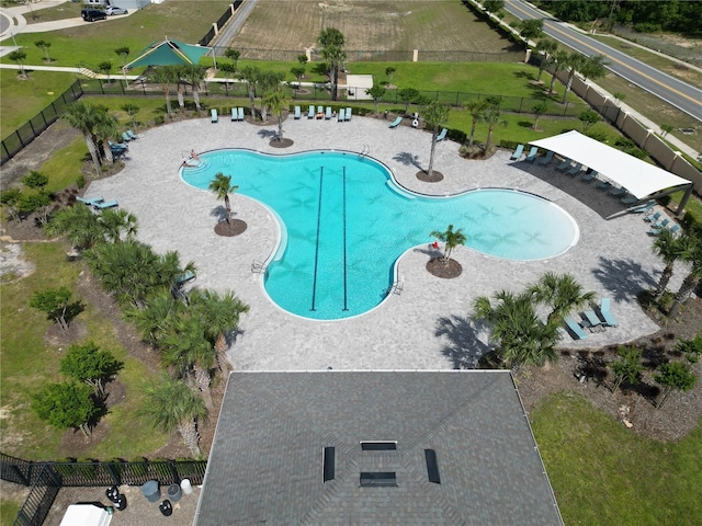 community pool featuring a patio and fence