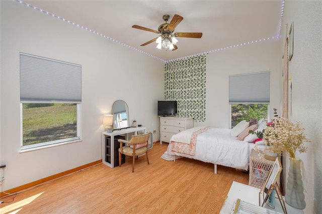 2390 Lake Easy Rd, Babson Park, FL 33827 - bedroom with baseboards, ceiling fan, and wood finished floors