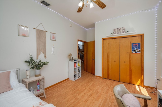 2390 Lake Easy Rd, Babson Park, FL 33827 - bedroom featuring visible vents, a closet, baseboards, a ceiling fan, and light wood finished floors
