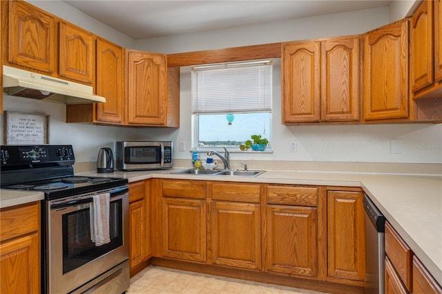2390 Lake Easy Rd, Babson Park, FL 33827 - kitchen with light countertops, a sink, under cabinet range hood, and stainless steel appliances
