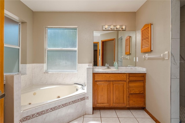 2390 Lake Easy Rd, Babson Park, FL 33827 - bathroom with a jetted tub, tile patterned floors, and vanity