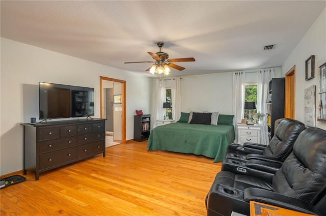 2390 Lake Easy Rd, Babson Park, FL 33827 - bedroom featuring light wood-style floors, multiple windows, ceiling fan, and visible vents